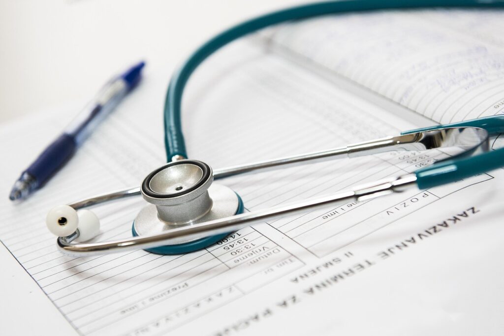 Insurance claim form next to a stethoscope