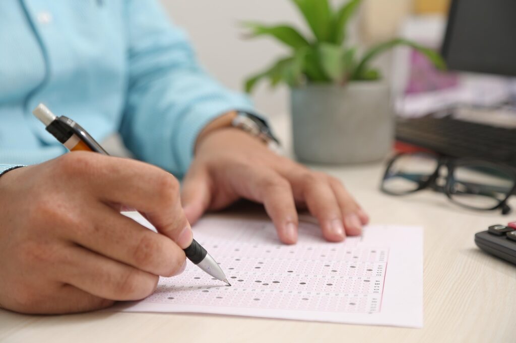 Person filling out a benefits application form